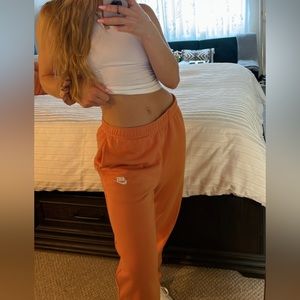 ORANGE NIKE SWEATPANTS